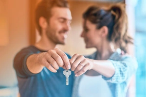 Couple with key to house